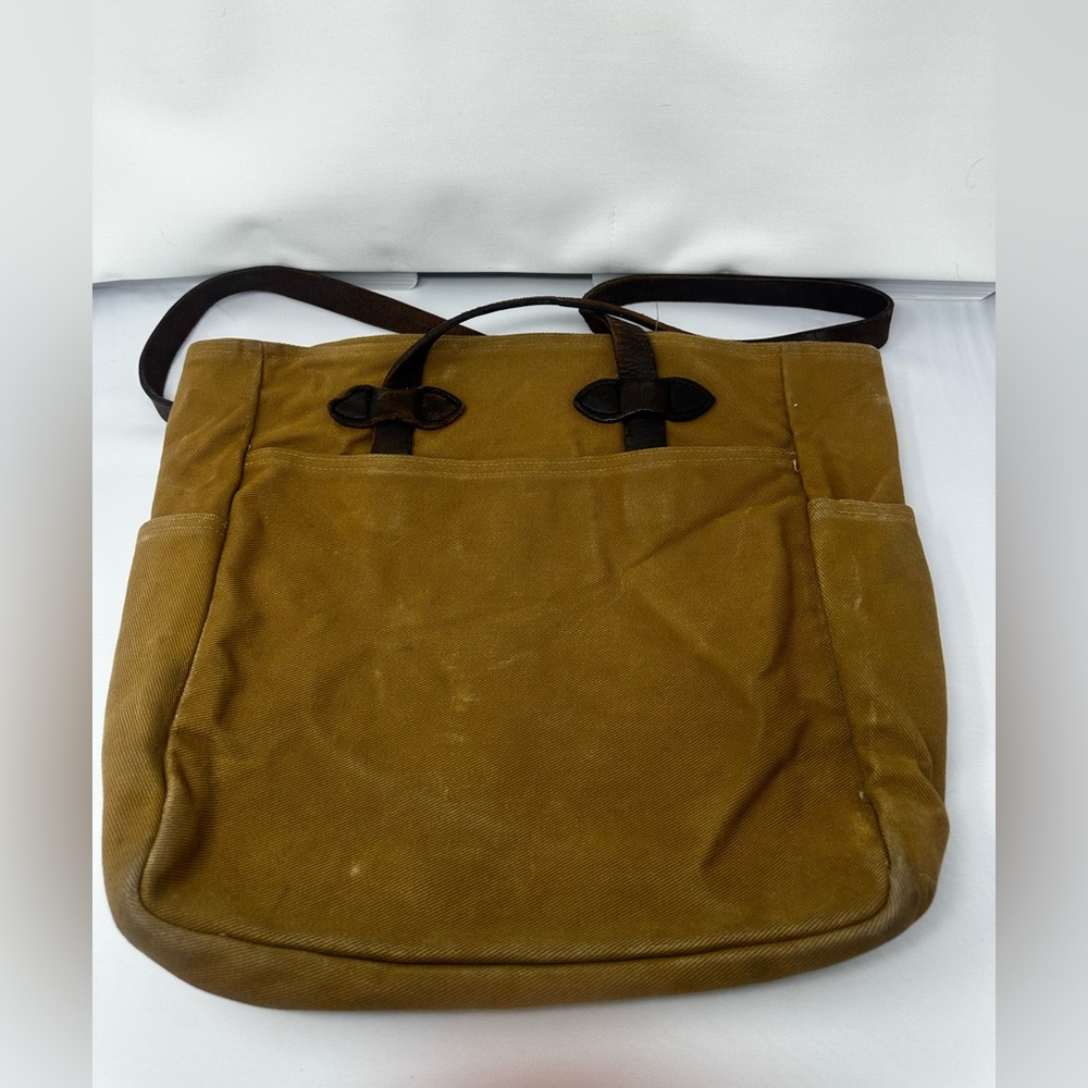 Filson canvas tote with leather straps.